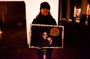 An MA Human Rights Student with a poster at the Silent Vigil for the Victims of the Rohyngia crisis, organized by Rights Effect