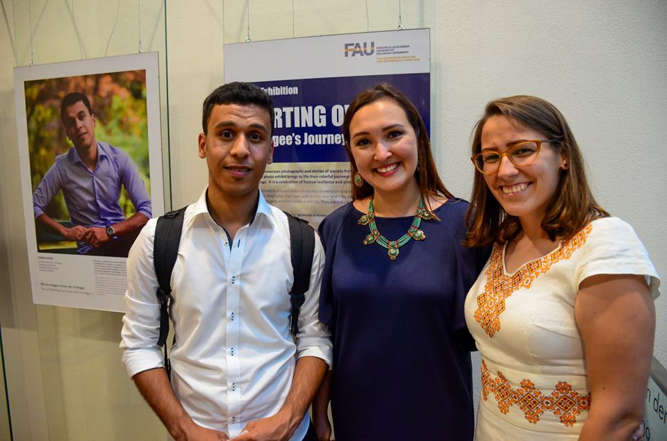 Photo of two members of the Photo Exhibit Team with one of the Interviewees for the Installation