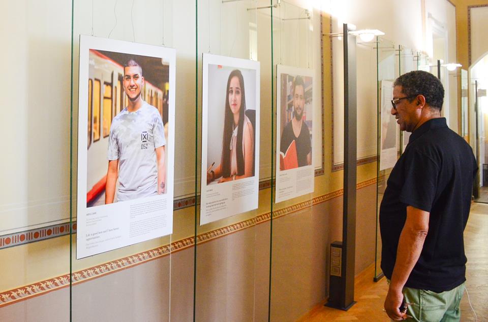 Photo of one of the Interviewees walking through the Exhibition