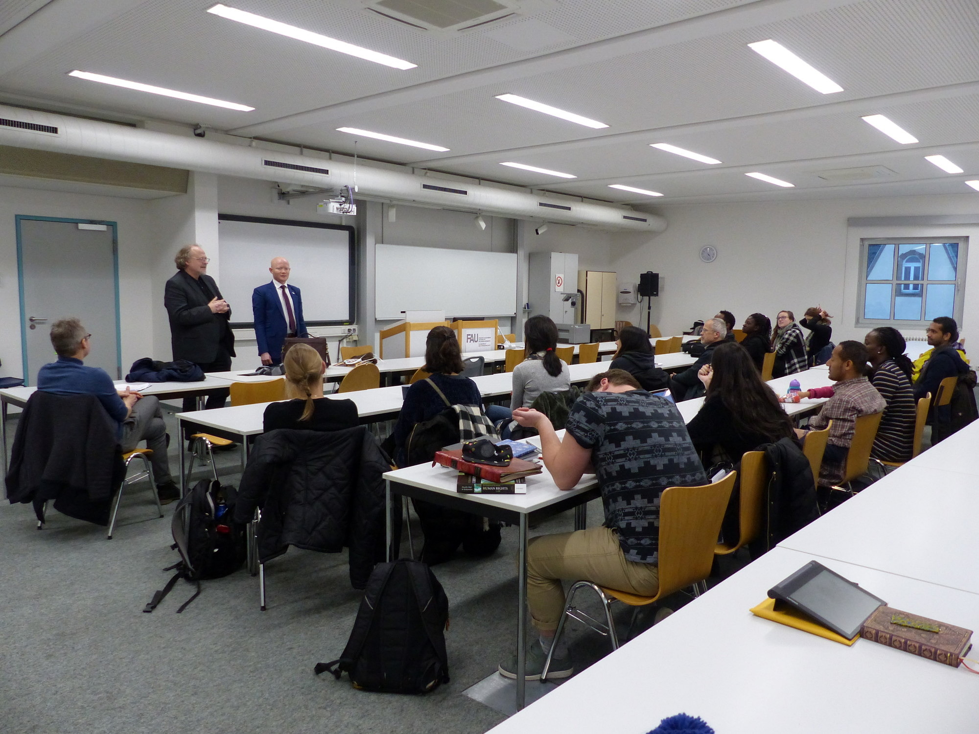 Prof. Bielefeldt introduces Dr. Possi to a group of human rights students