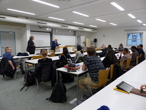 Picture of Ambassador Possi speaking to the Human Rights Class