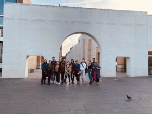 Group picture of students at welcoming orientation in front of arch of Nuremberg's street of human rights