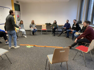 Picture of students at Former Nazi Rally grounds workshop with a timeline.