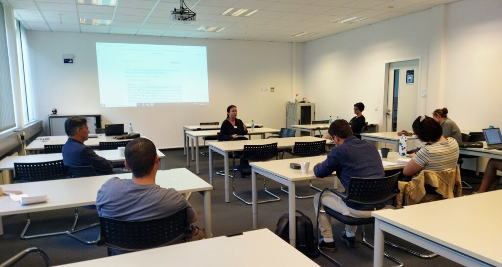 Picture of Başak Çalı during the Meet the Author workshop and some listening students.