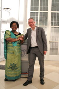 Dr. Herzberger-Fofana and Prof. Krajewski shaking hands